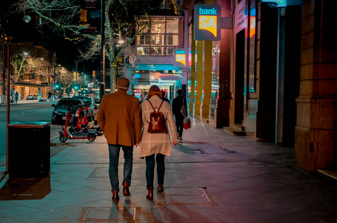 romantic couple walking in street