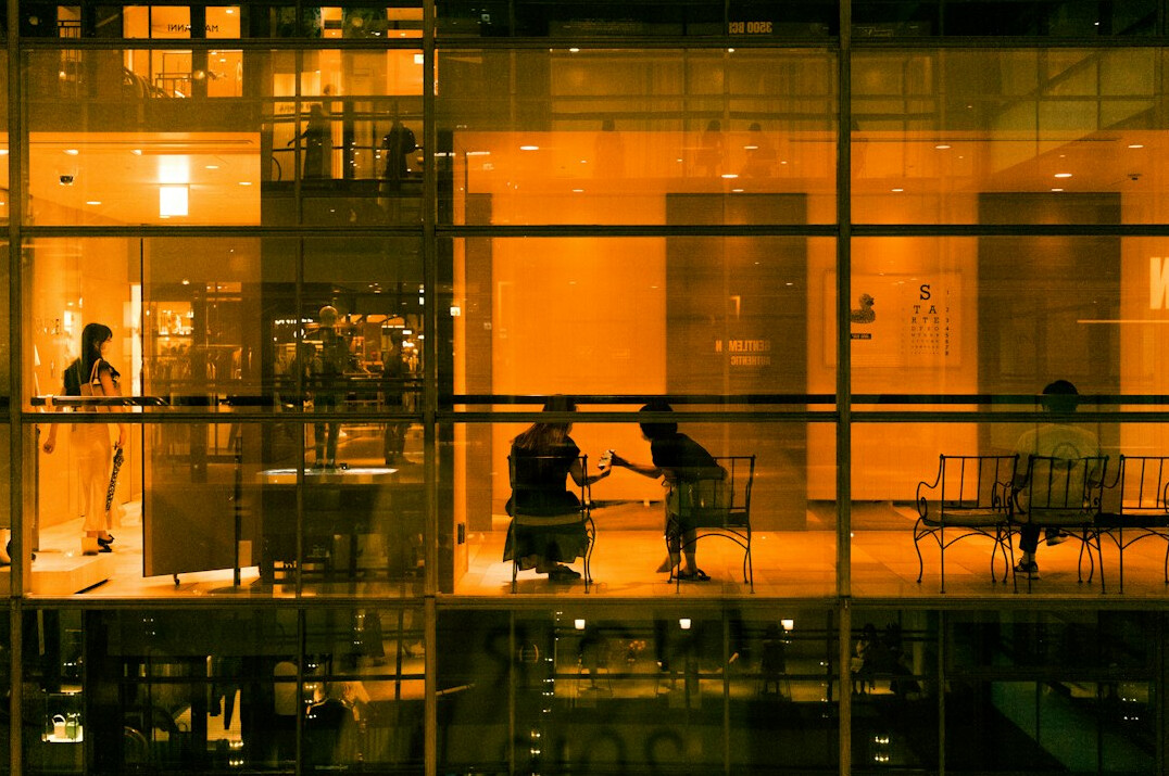 Two professionals shaking hands after a business discussion