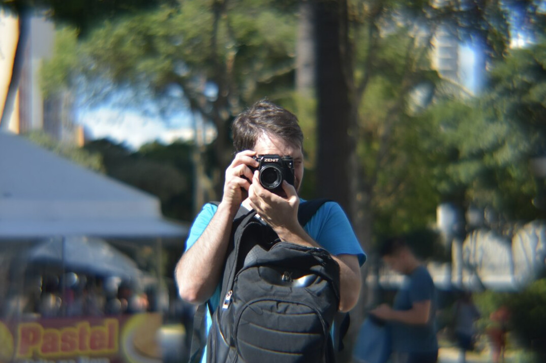 Photographer with camera covering a public event
