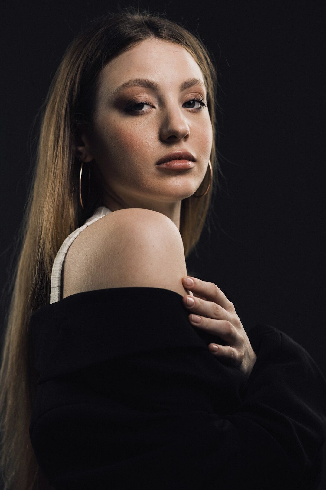 Studio portrait of a young European woman reporter