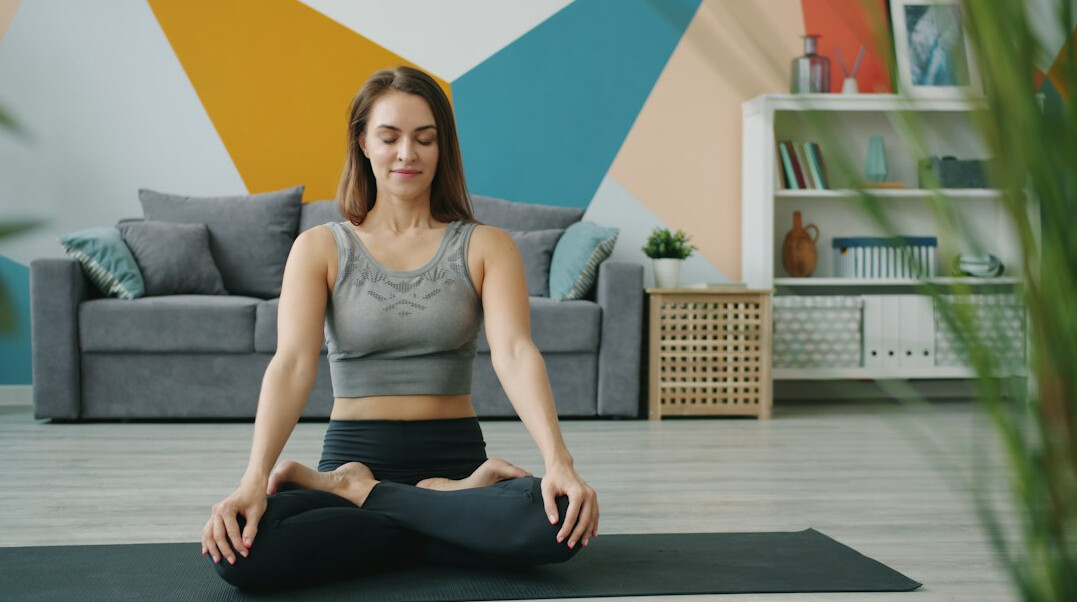 woman doing yoga at home